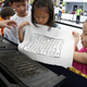 Children play with woodblock printing in Seoul on Hangul Day in 2017.
